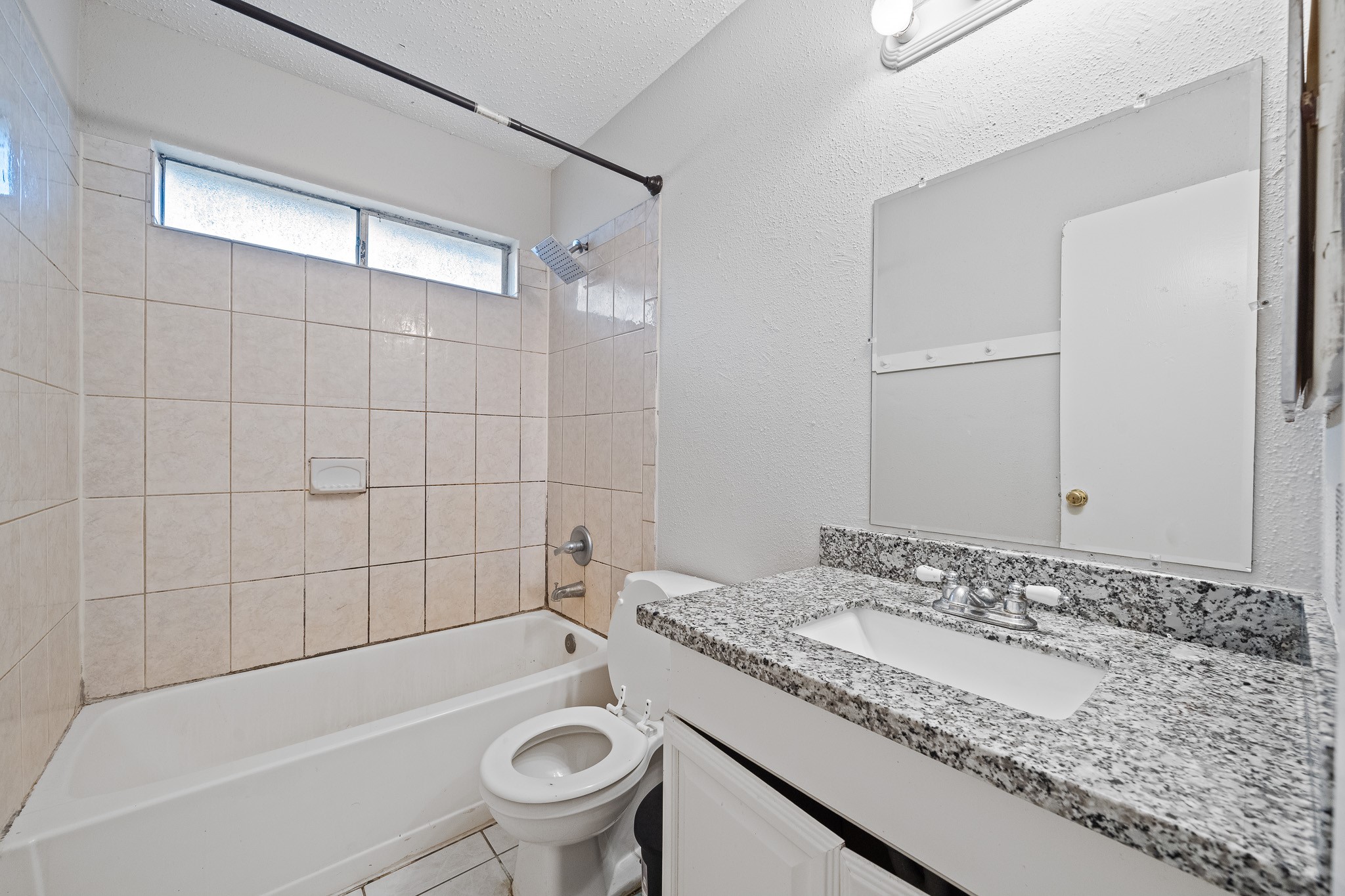 20115 Raingate Lane Katy, TX 77449 - Photo 14 of 25 a bathroom with a granite countertop sink a toilet and bathtub