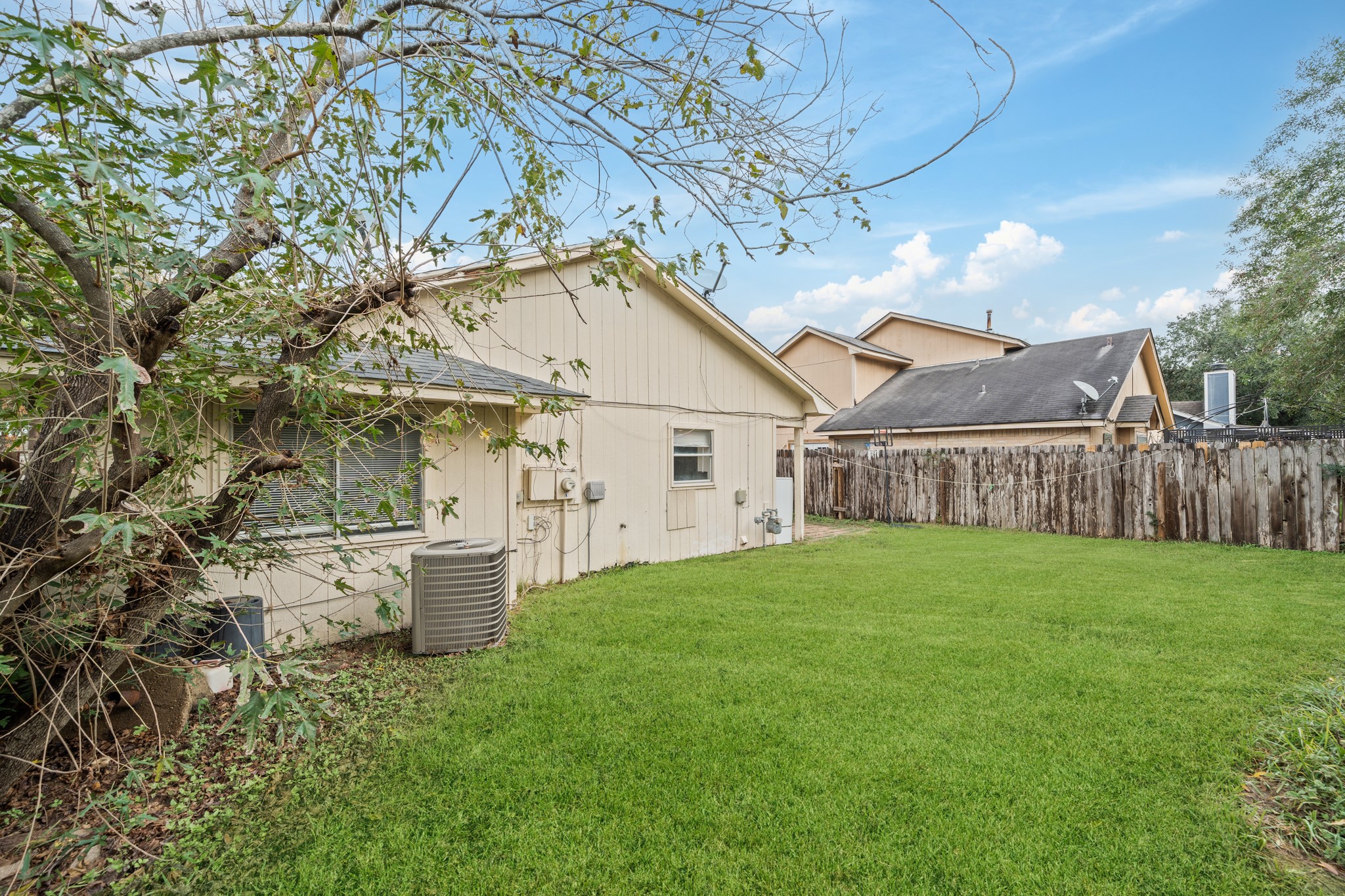 20115 Raingate Lane Katy, TX 77449 - Photo 23 of 25 a view of a big house with a big yard and large tree