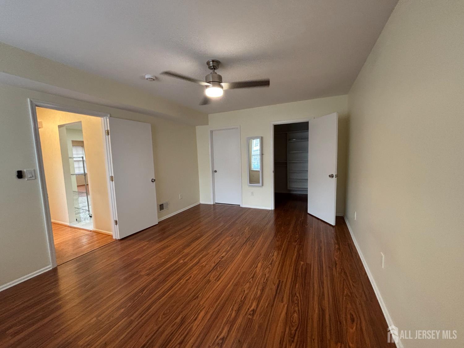 1301 Plymouth Road North Brunswick, NJ 08902 - Photo 11 of 21 a view of an empty room with wooden floor