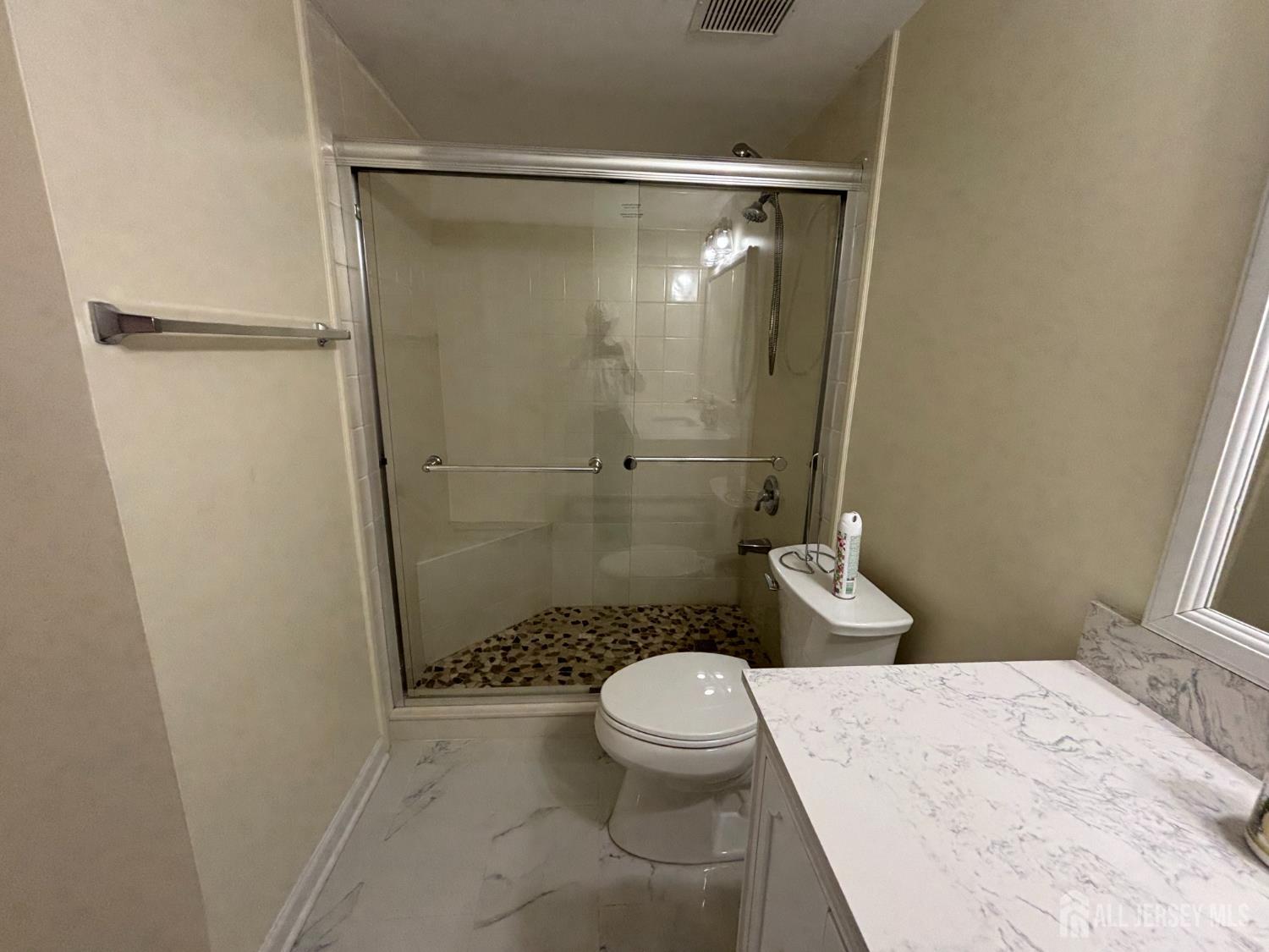 1301 Plymouth Road North Brunswick, NJ 08902 - Photo 13 of 21 a bathroom with a shower and a toilet