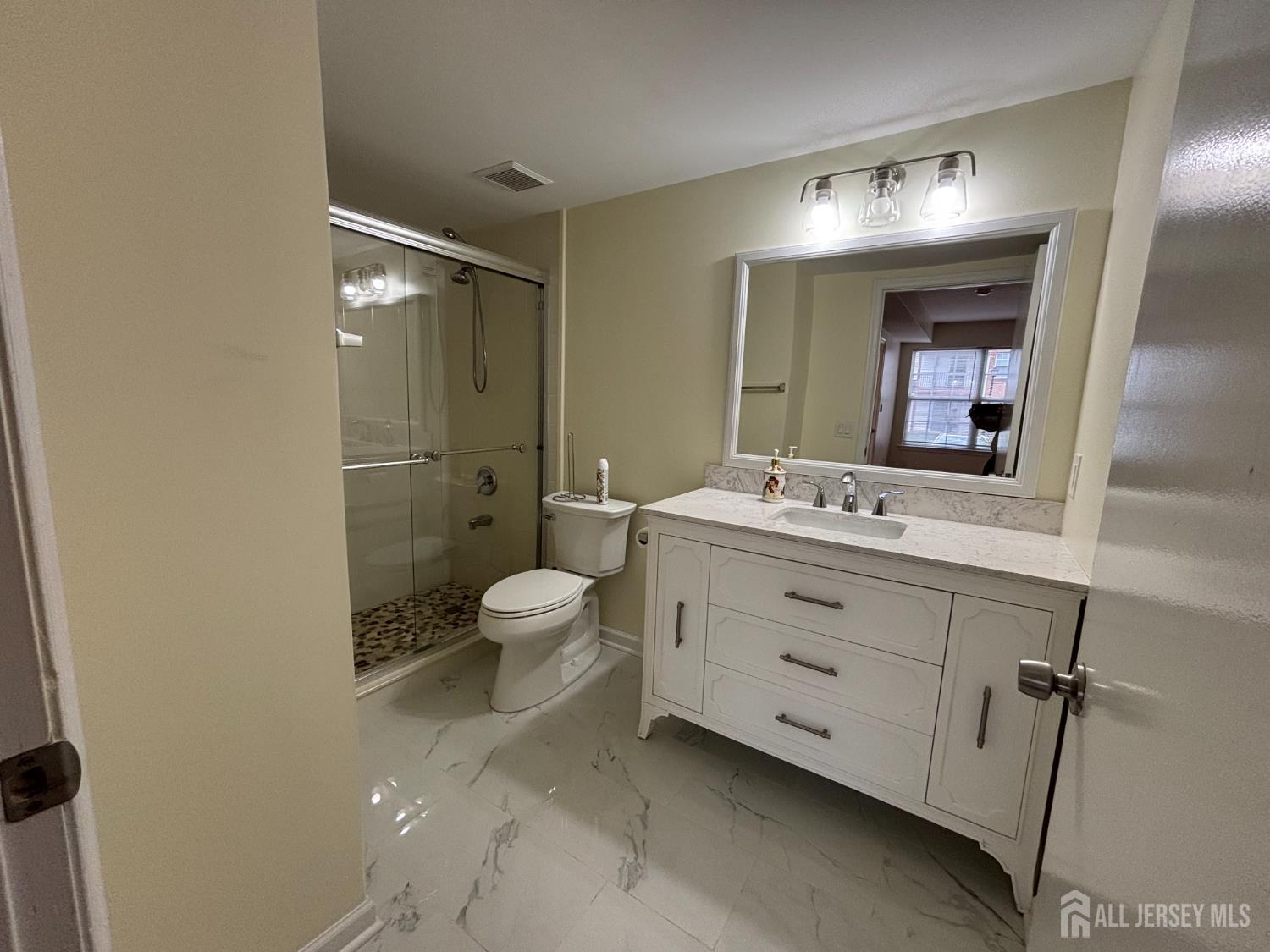 1301 Plymouth Road North Brunswick, NJ 08902 - Photo 17 of 21 a bathroom with a double vanity sink mirror and toilet