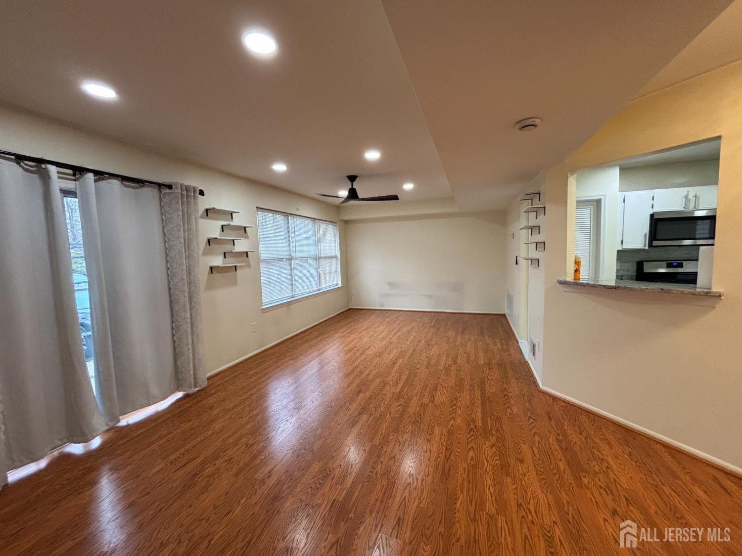 1301 Plymouth Road North Brunswick, NJ 08902 - Photo 9 of 21 a view of empty room with wooden floor and electronic appliances
