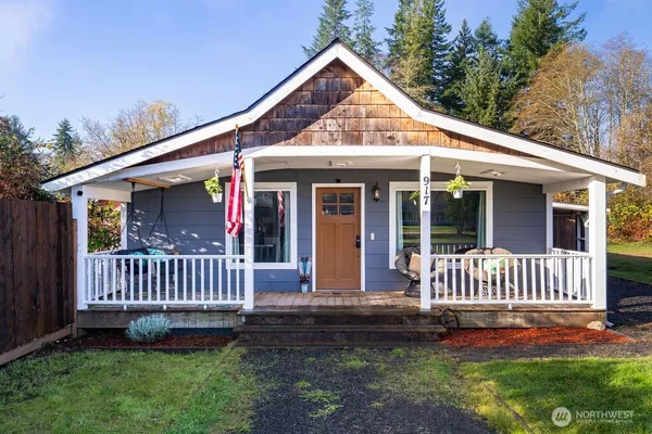 a view of a house with a yard and deck