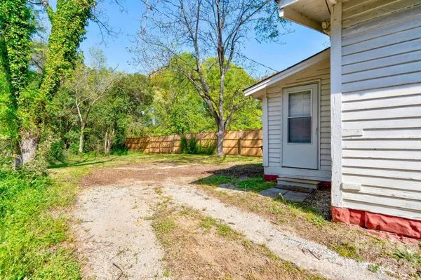 a view of a back yard of the house