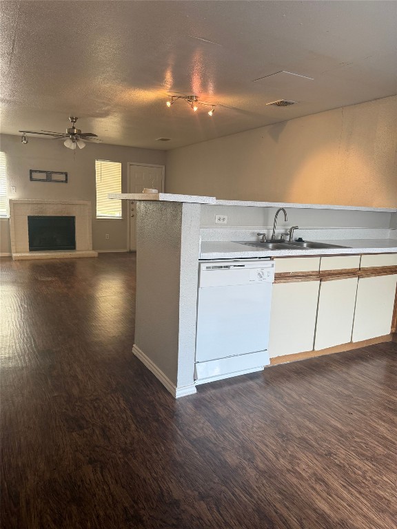 1802 River Crossing Circle, Unit C Austin, TX 78741 - Photo 19 of 19 an empty room with wooden floor fireplace and windows