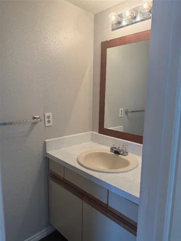 a white toilet sitting next to a shower
