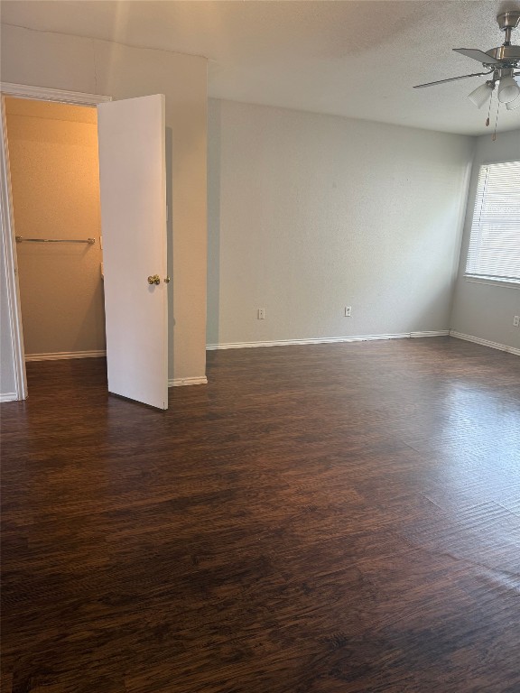 1802 River Crossing Circle, Unit C Austin, TX 78741 - Photo 5 of 19 an empty room with wooden floor and windows