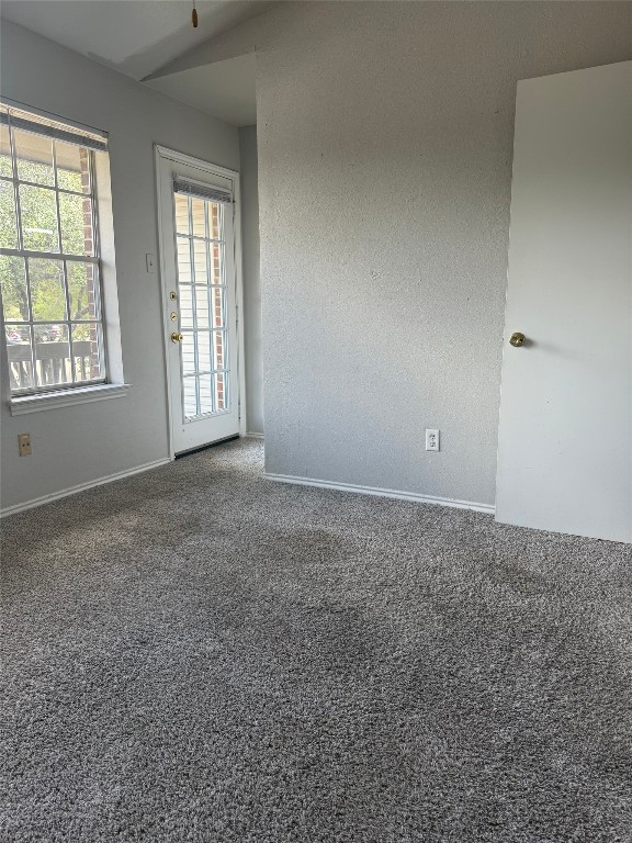 1802 River Crossing Circle, Unit C Austin, TX 78741 - Photo 9 of 19 an empty room with windows