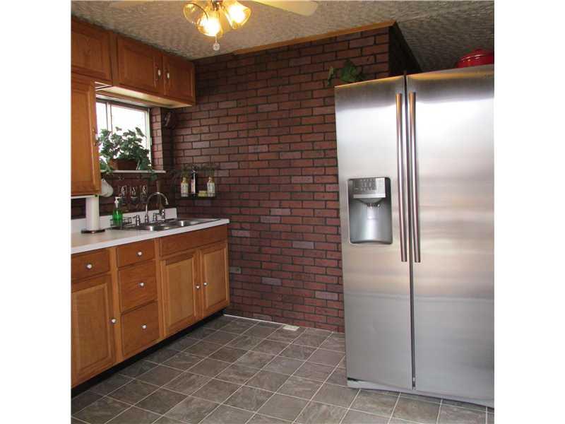 222 Little Blue Road Georgetown, PA 15043 - Photo 6 of 25 Kitchen. Nice kitchen cabinetry,stainless refrigerator. Walkout to side deck.