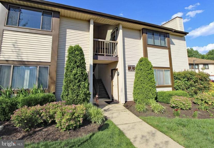 1003 Britton Place Voorhees, NJ 08043 - Photo 1 of 16 a front view of a house with garden