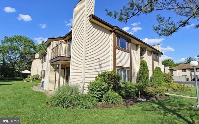 1003 Britton Place Voorhees, NJ 08043 - Photo 15 of 16 a front view of a house with garden