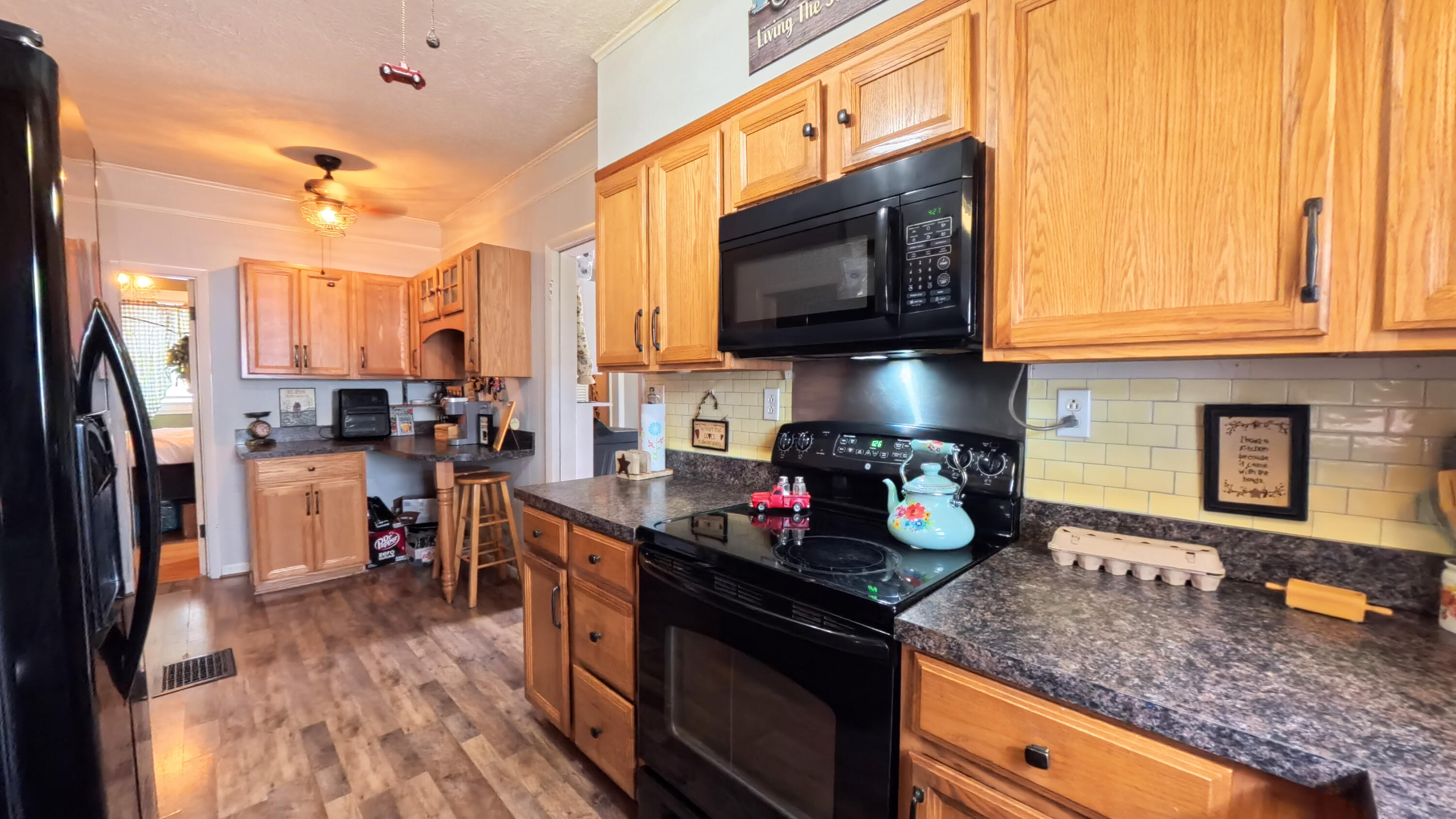 413 Elm Street Ravenna, KY 40472 - Photo 16 of 42 Extra storage cabinets and an eating spot as well!