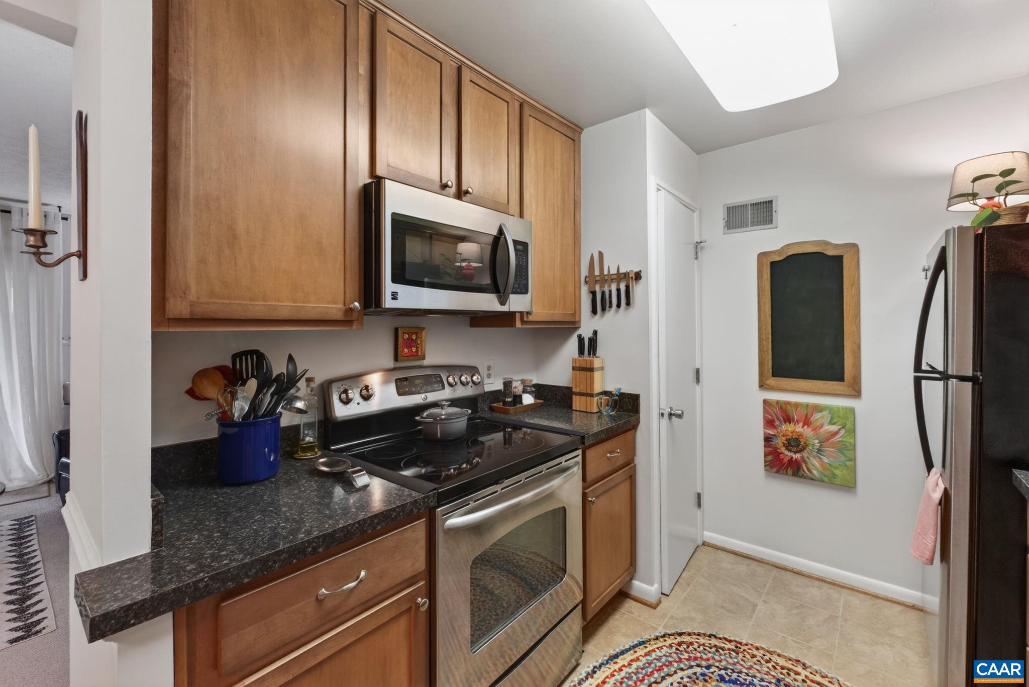 114 Turtle Creek Road, Unit 4 Charlottesville, VA 22901 - Photo 10 of 41 a kitchen with stainless steel appliances granite countertop a refrigerator sink and stove