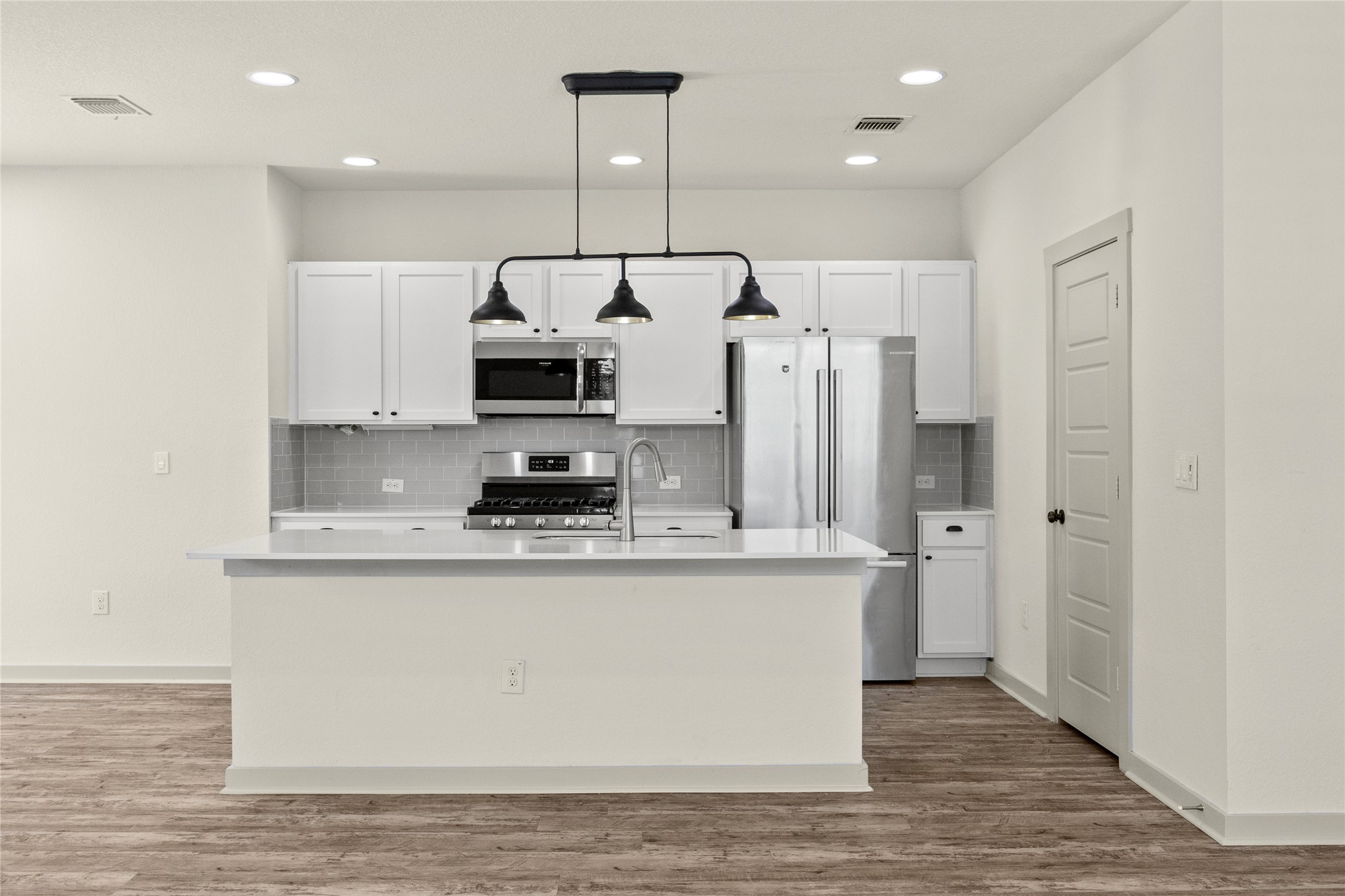 10307 Criswell Road Austin, TX 78754 - Photo 8 of 35 Recessed lighting, Bosch fridge, large walk-in pantry, lots of cabinet space!