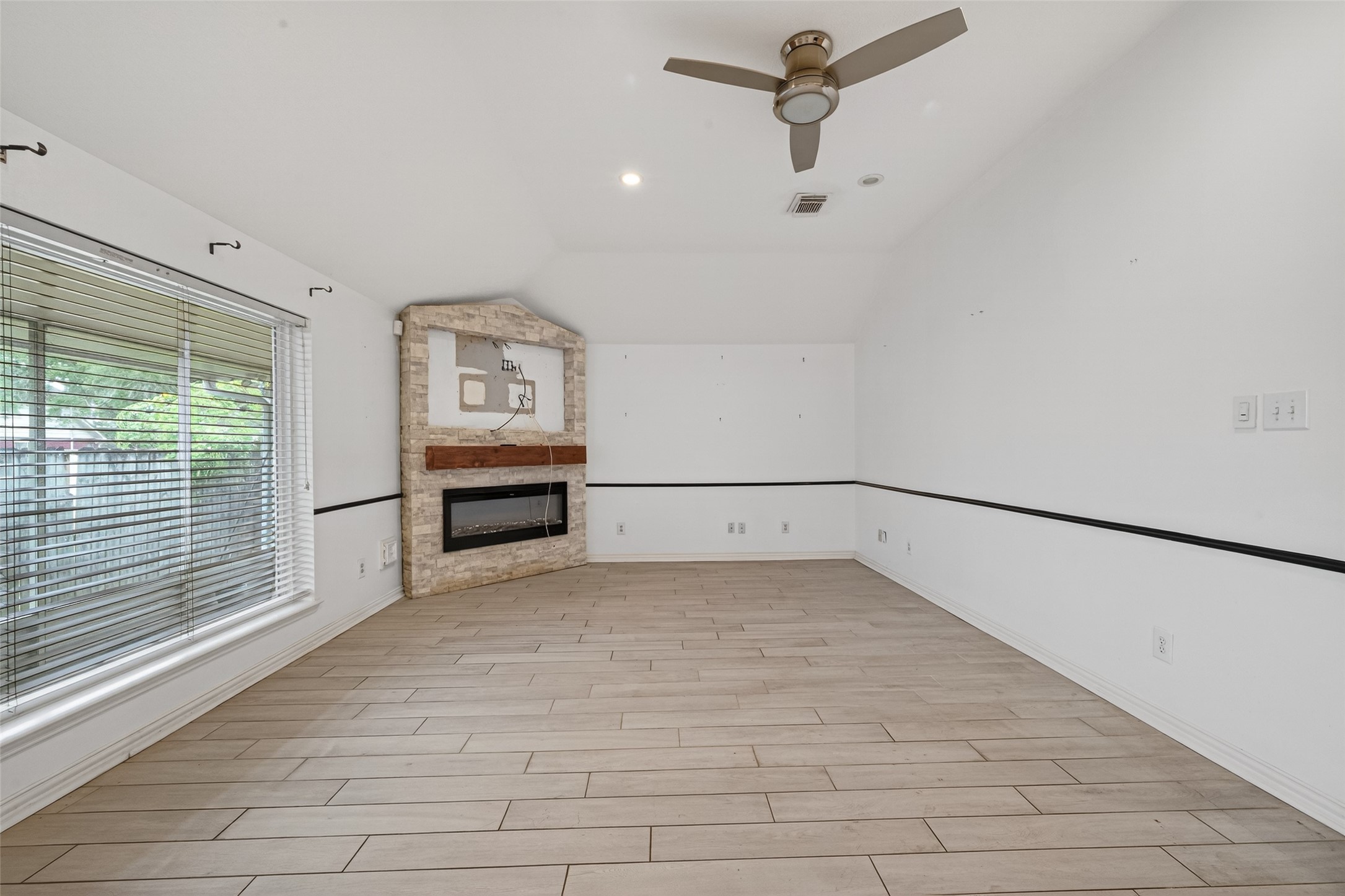 2214 Ruffian Lane Stafford, TX 77477 - Photo 15 of 31 a view of a livingroom with a projector & cabinets