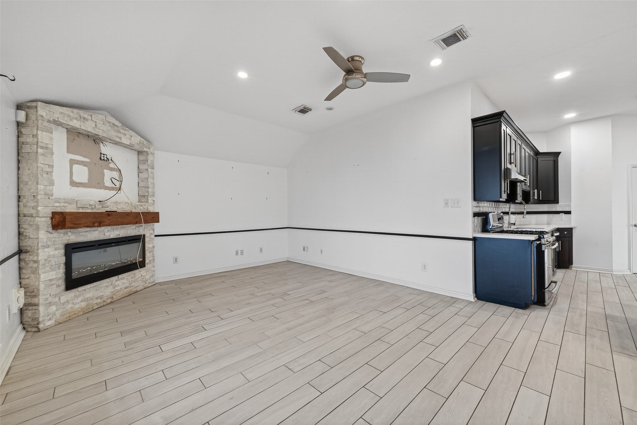2214 Ruffian Lane Stafford, TX 77477 - Photo 16 of 31 a view of kitchen with microwave and stove