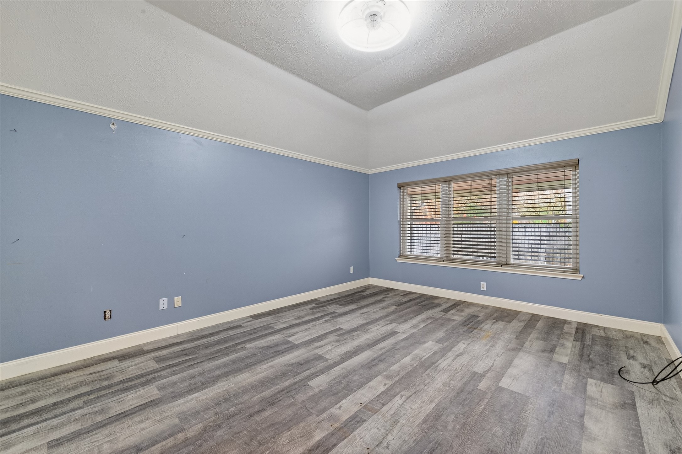 2214 Ruffian Lane Stafford, TX 77477 - Photo 23 of 31 a view of an empty room with wooden floor and a window