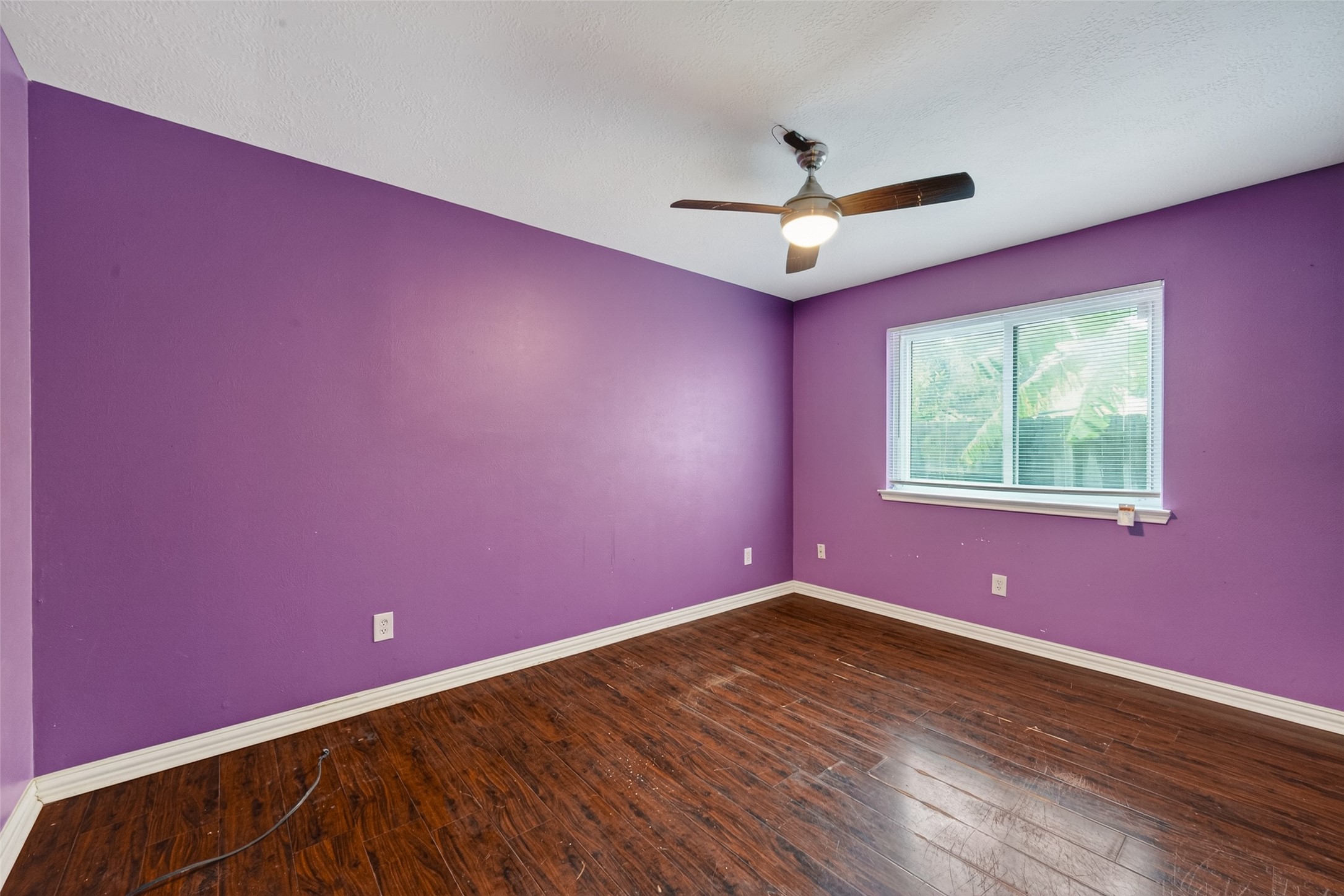 2214 Ruffian Lane Stafford, TX 77477 - Photo 26 of 31 a view of empty room with wooden floor and fan