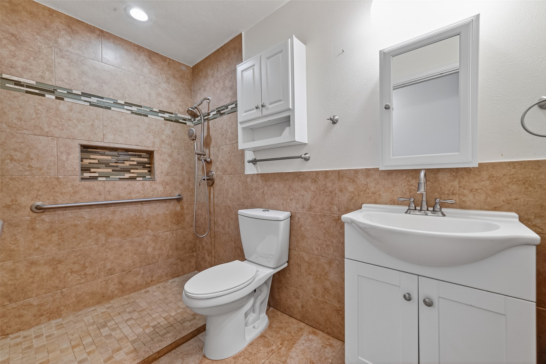 2214 Ruffian Lane Stafford, TX 77477 - Photo 29 of 31 a bathroom with a sink toilet and shower