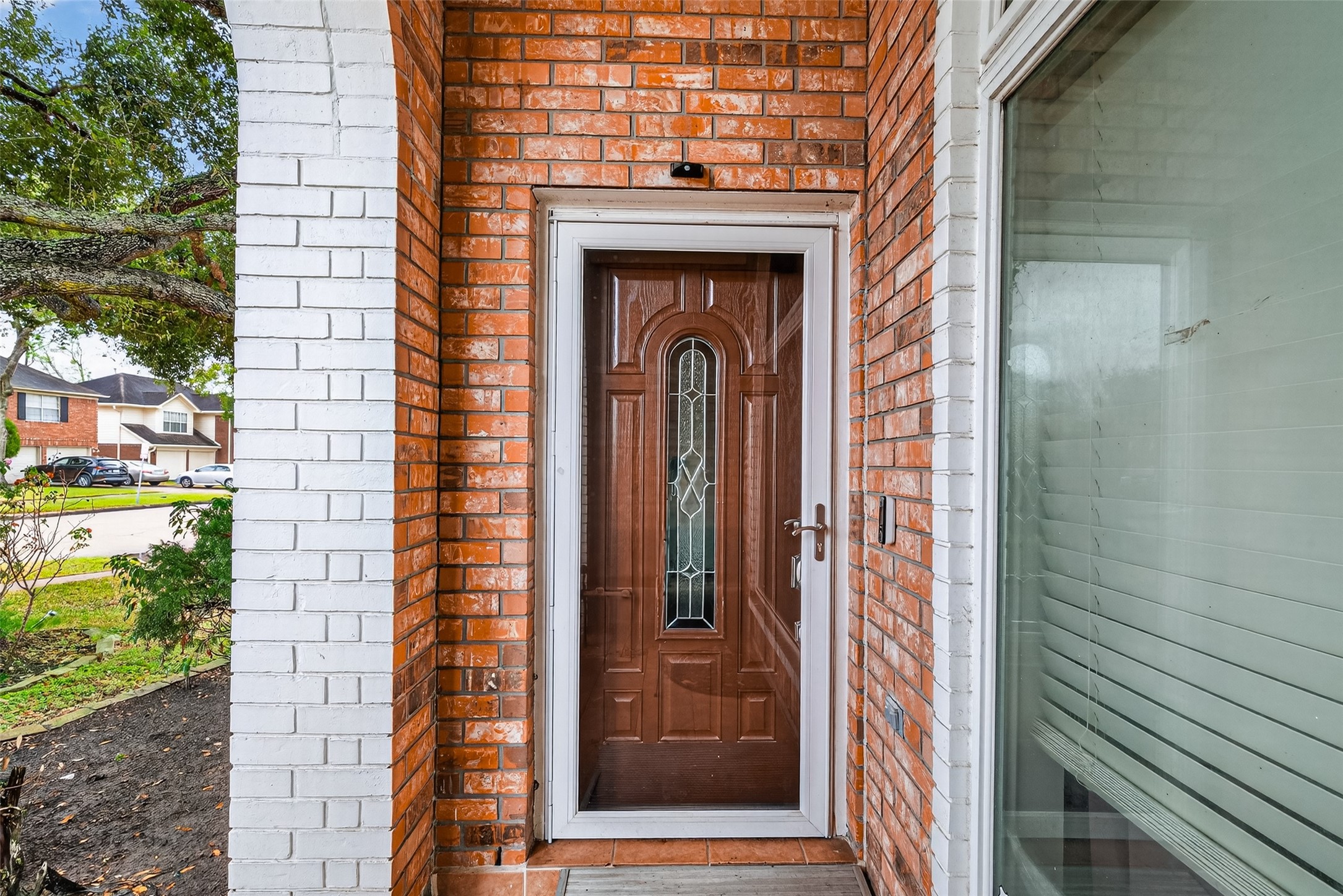 2214 Ruffian Lane Stafford, TX 77477 - Photo 5 of 31 a front view of a house with a glass door