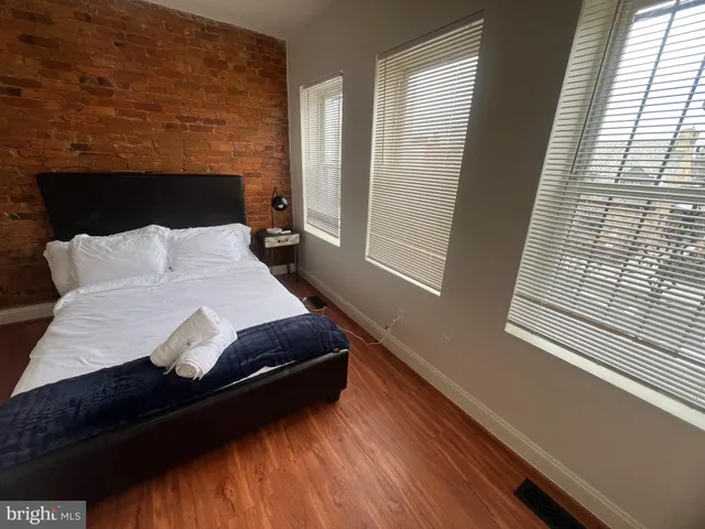 a bedroom with a bed and window