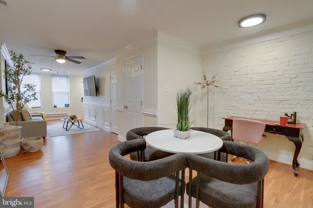 a kitchen with stainless steel appliances granite countertop a refrigerator a stove a sink and a microwave