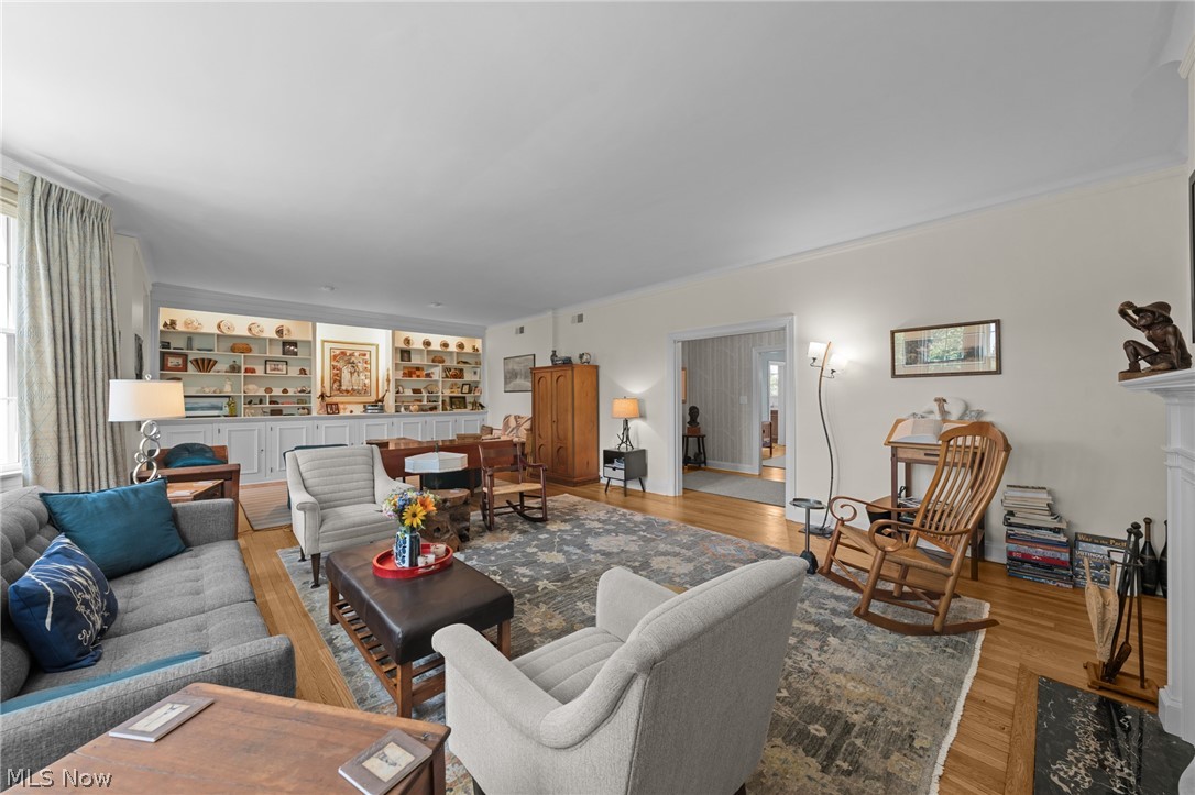12546 Cedar Road, Unit 4 Cleveland Heights, OH 44106 - Photo 12 of 43 Spacious living room with
hardwood floors, bay window, decorative fireplace flanked with custom built-ins