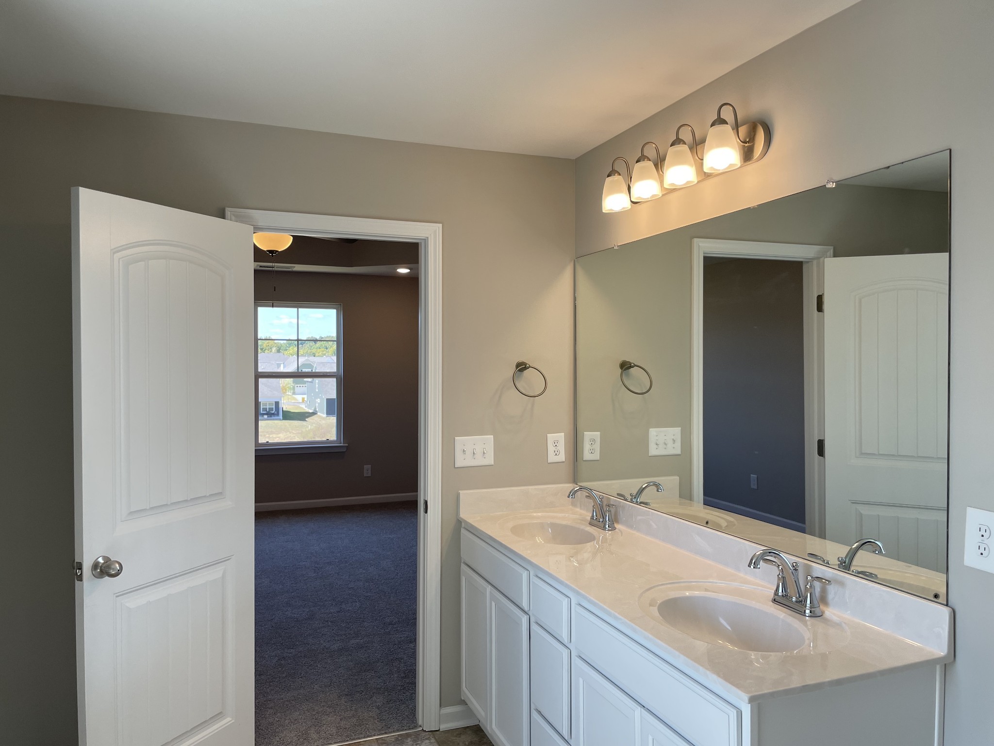 1038 Wiseman Farm Road Fairview, TN 37062 - Photo 6 of 11 a en suite bathroom with a sink and a mirror