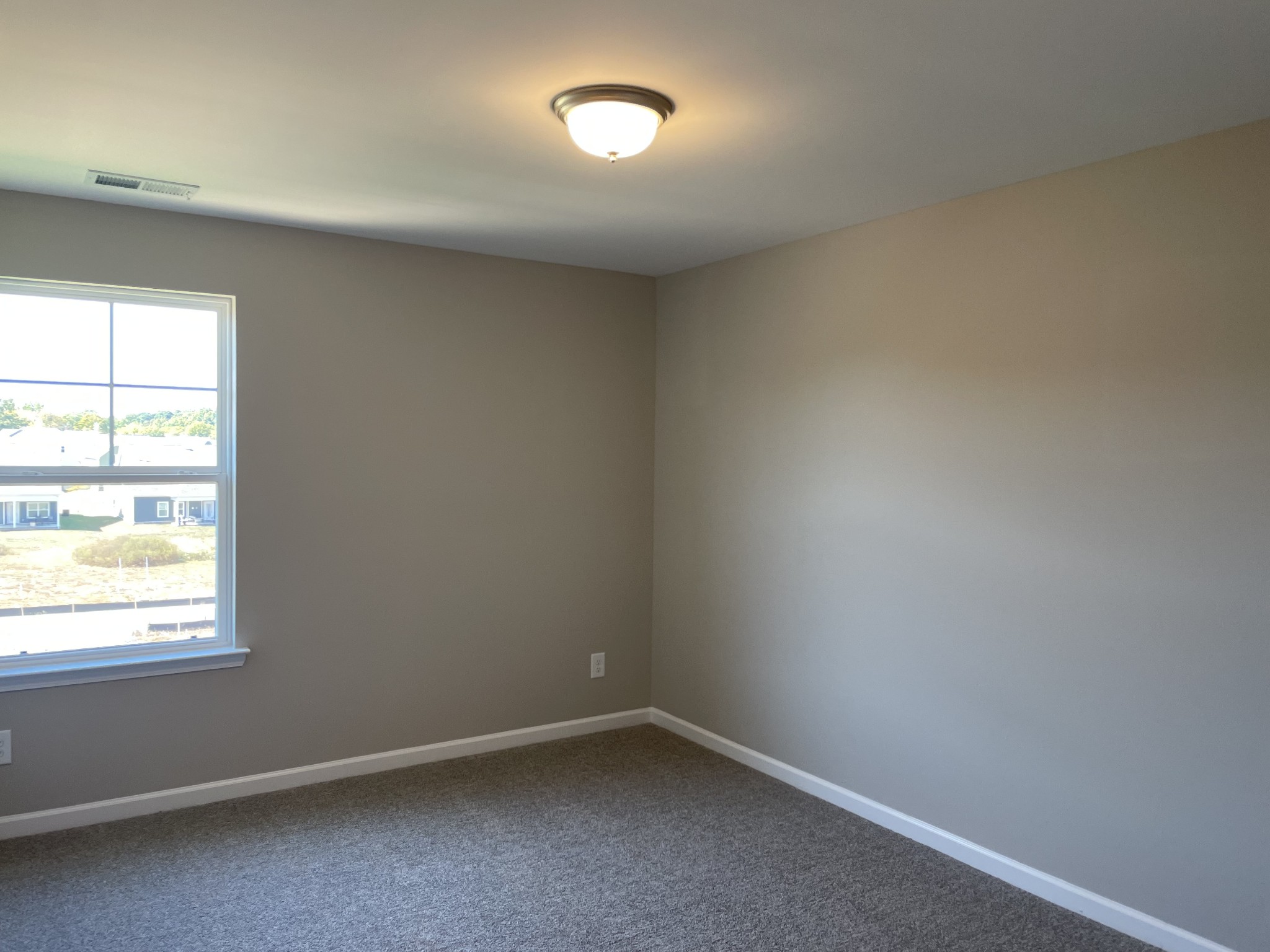 1038 Wiseman Farm Road Fairview, TN 37062 - Photo 9 of 11 an empty room with a window