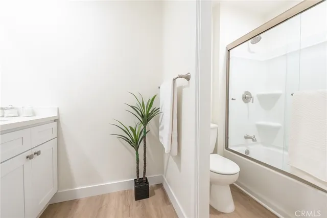 a bathroom with a toilet a sink and a shower