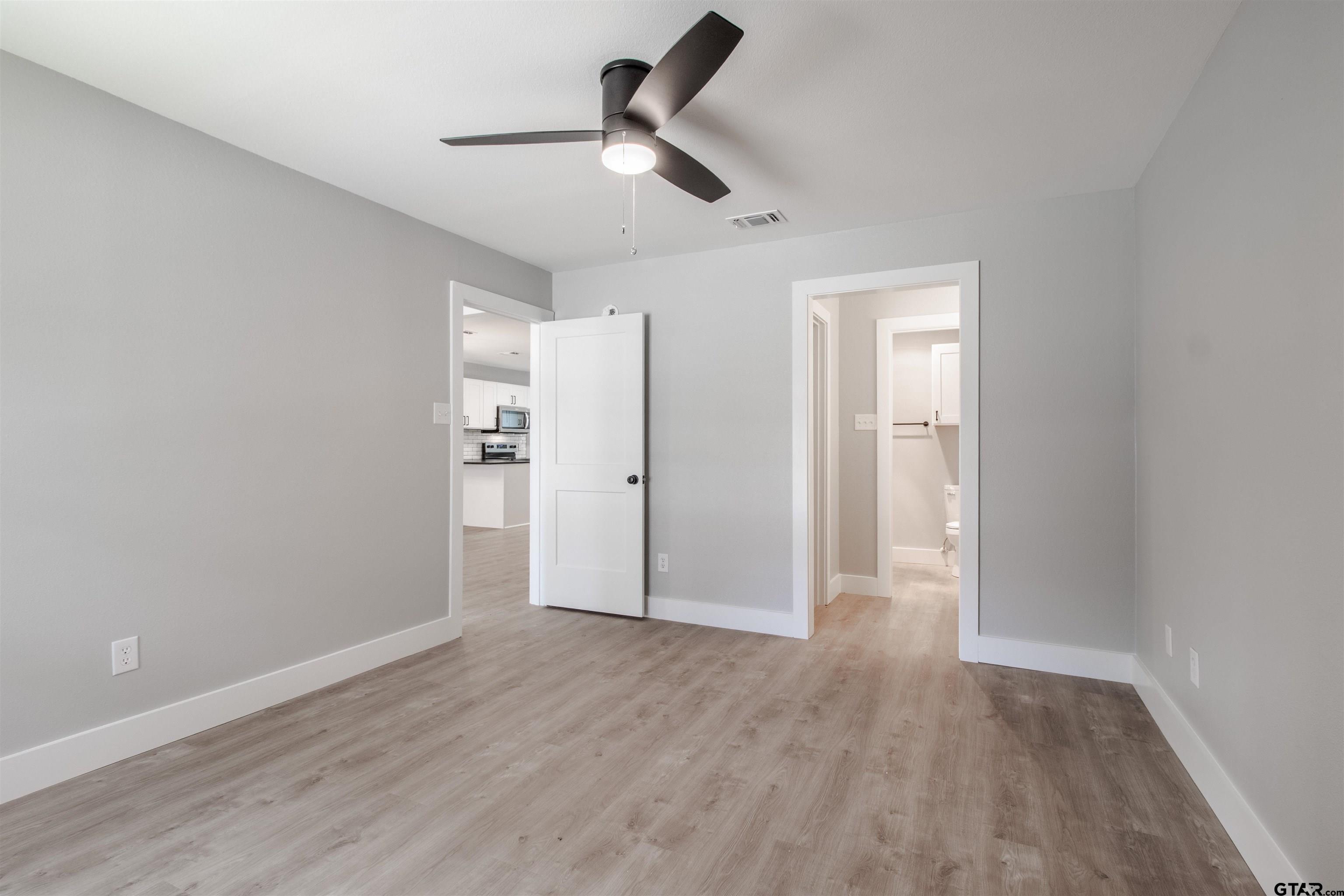 415 Thigpen Drive Tyler, TX 75703 - Photo 20 of 32 a view of empty room with wooden floor