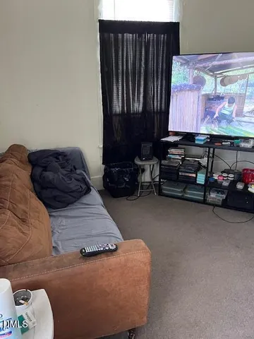 a room with furniture and a flat screen tv