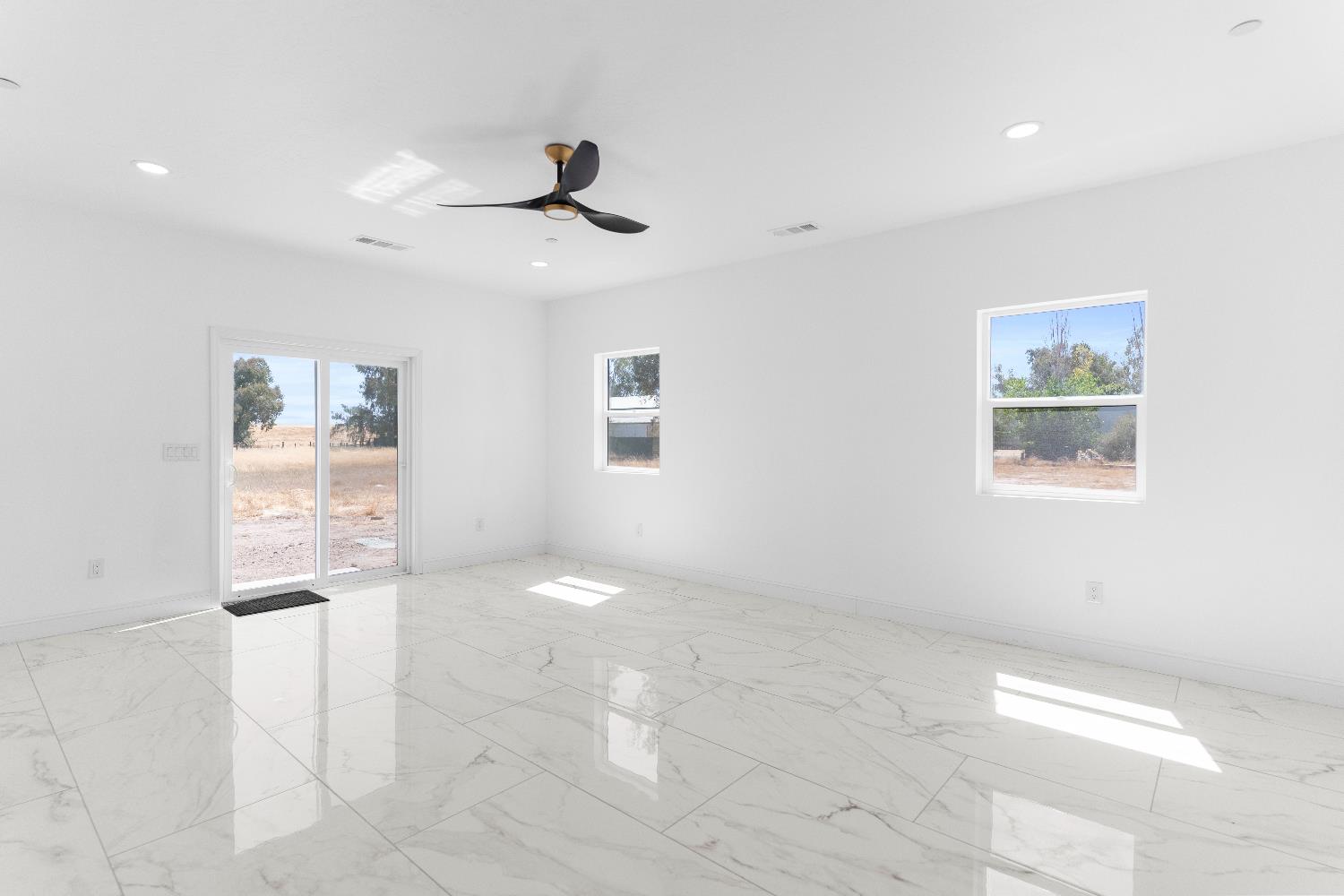 36950 Pauline Avenue Madera, CA 93636 - Photo 14 of 48 a view of an empty room with a window