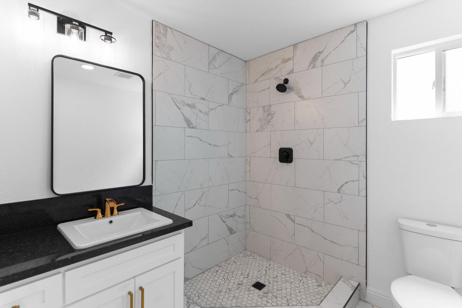 36950 Pauline Avenue Madera, CA 93636 - Photo 16 of 48 a bathroom with a sink toilet and shower