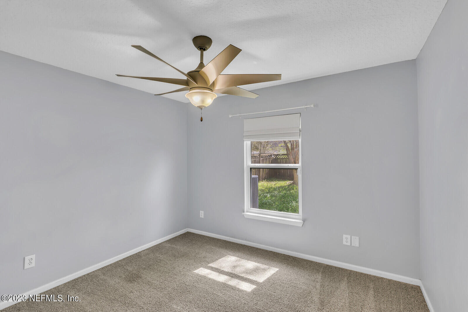 951 Silver Spring Court St. Augustine, FL 32092 - Photo 8 of 17 an empty room with a window and a fan