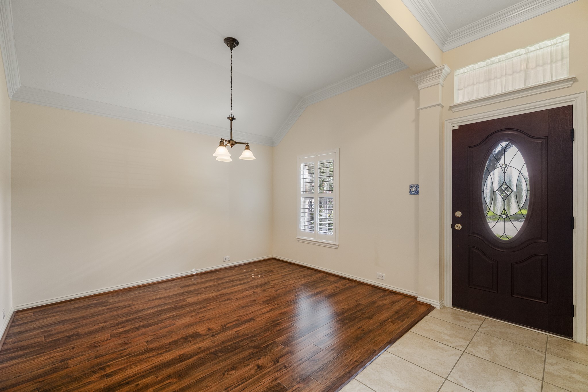 20014 Queens Oak Court Spring, TX 77379 - Photo 5 of 49 a view of an empty room with wooden floor and a window