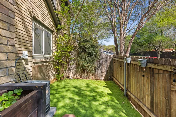 a backyard of a house with lots of green space