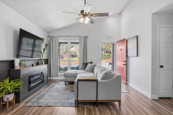 a living room with furniture and a large window