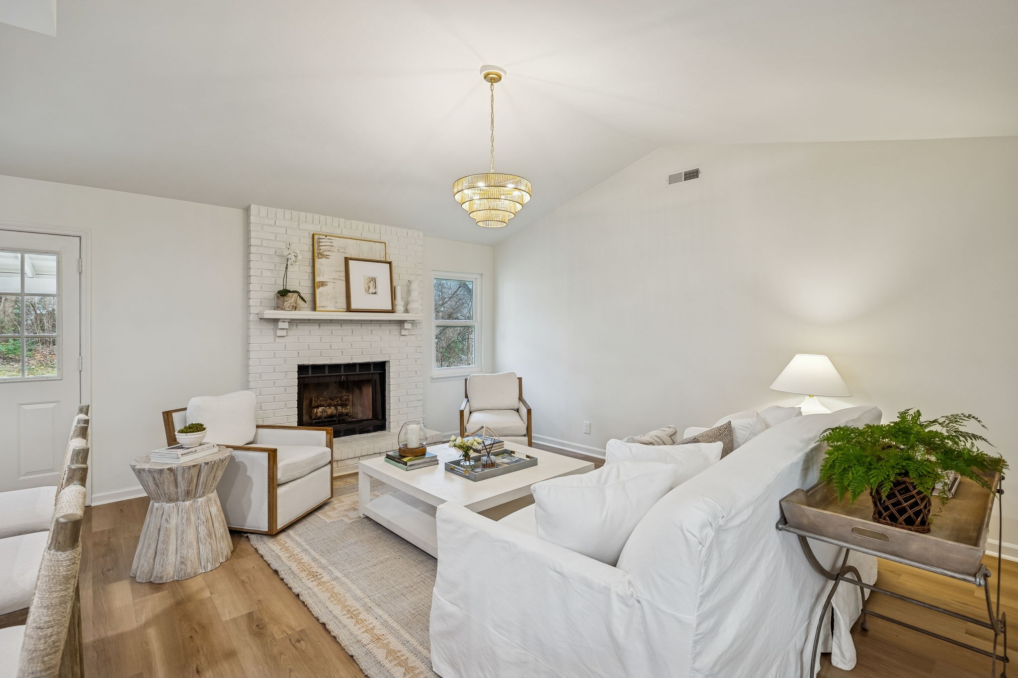 112 Ridgemont Place Franklin, TN 37064 - Photo 8 of 18 a living room with furniture a fireplace and a table