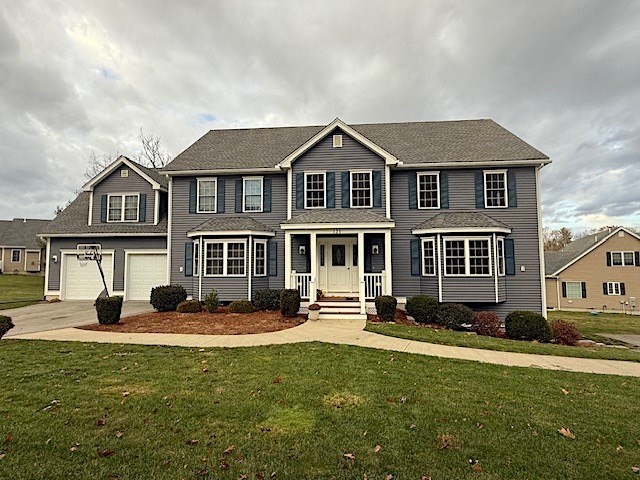 a front view of a house with a yard