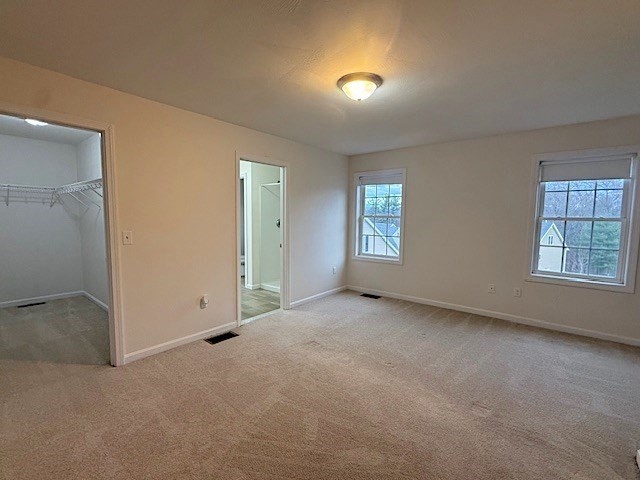 121 Robin Hill Road, Unit B Groton, MA 01450 - Photo 11 of 18 an empty room with windows and closet