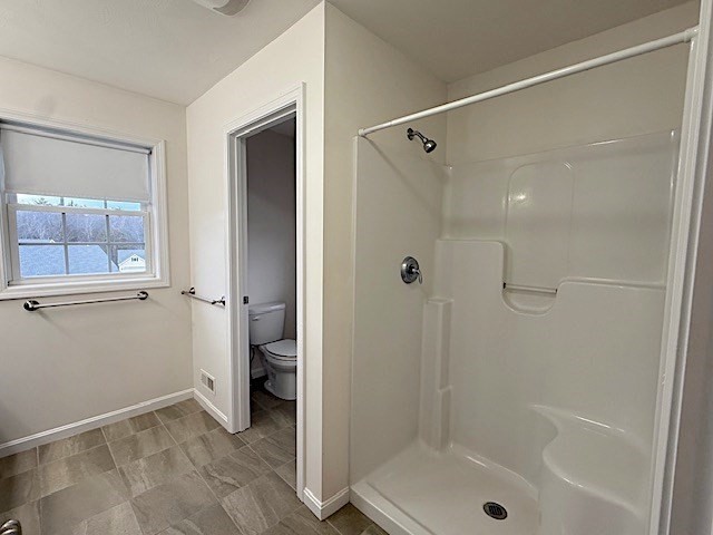 121 Robin Hill Road, Unit B Groton, MA 01450 - Photo 13 of 18 a bathroom that has a glass shower door