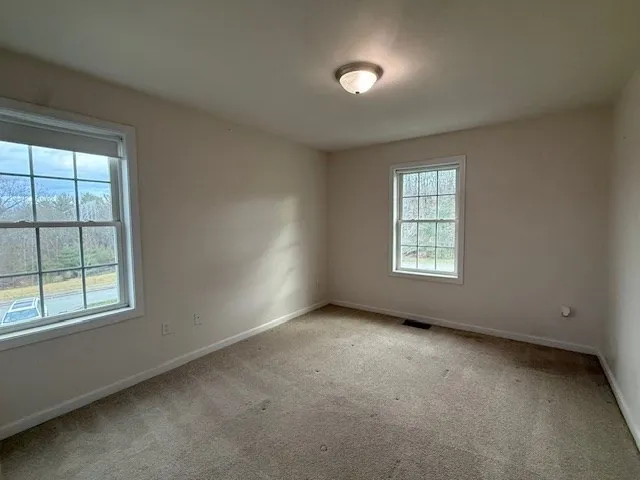 an empty room with closet area