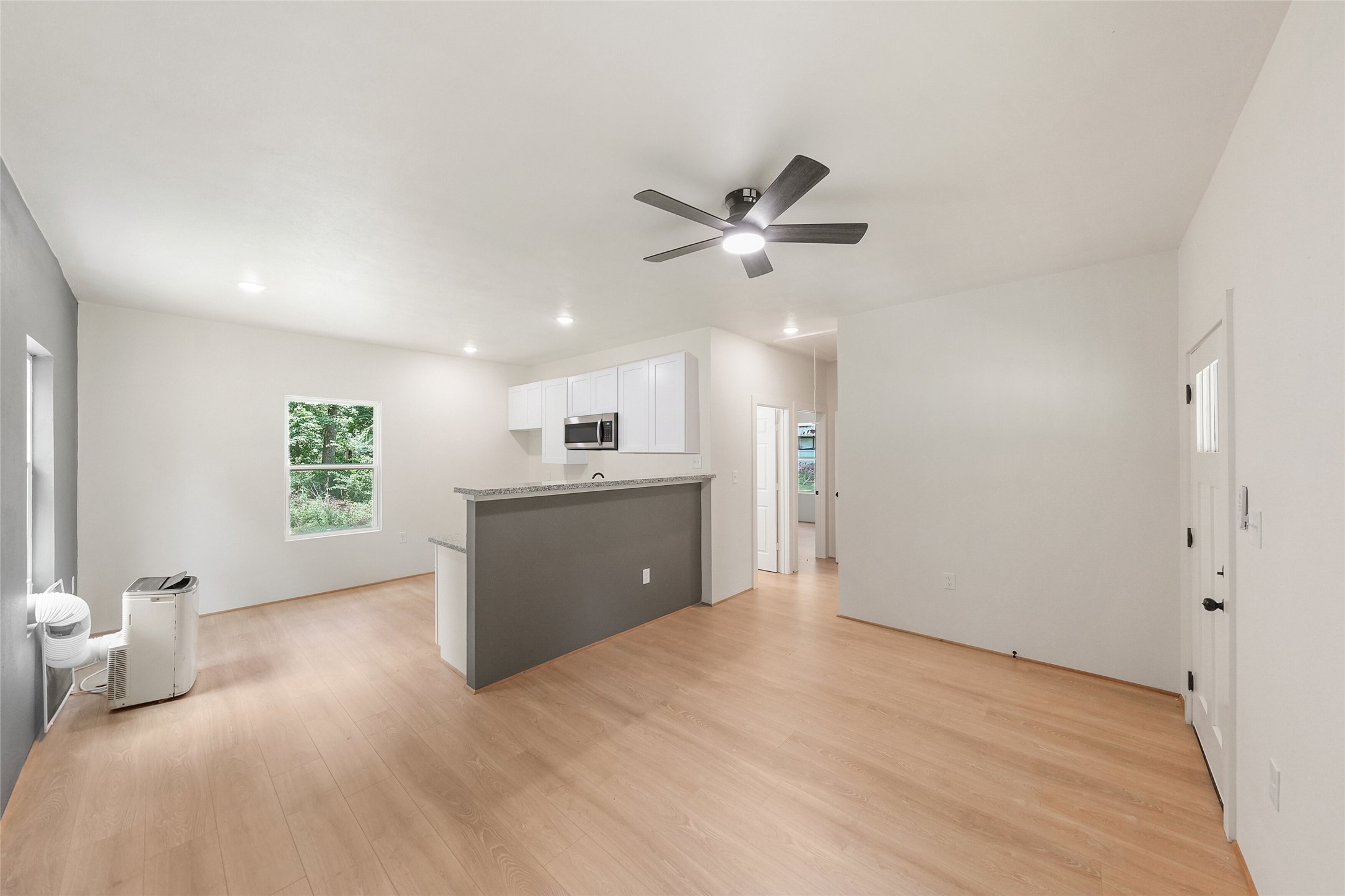 136 Ash Street Trinity, TX 75862 - Photo 18 of 31 a view of an empty room with a kitchen