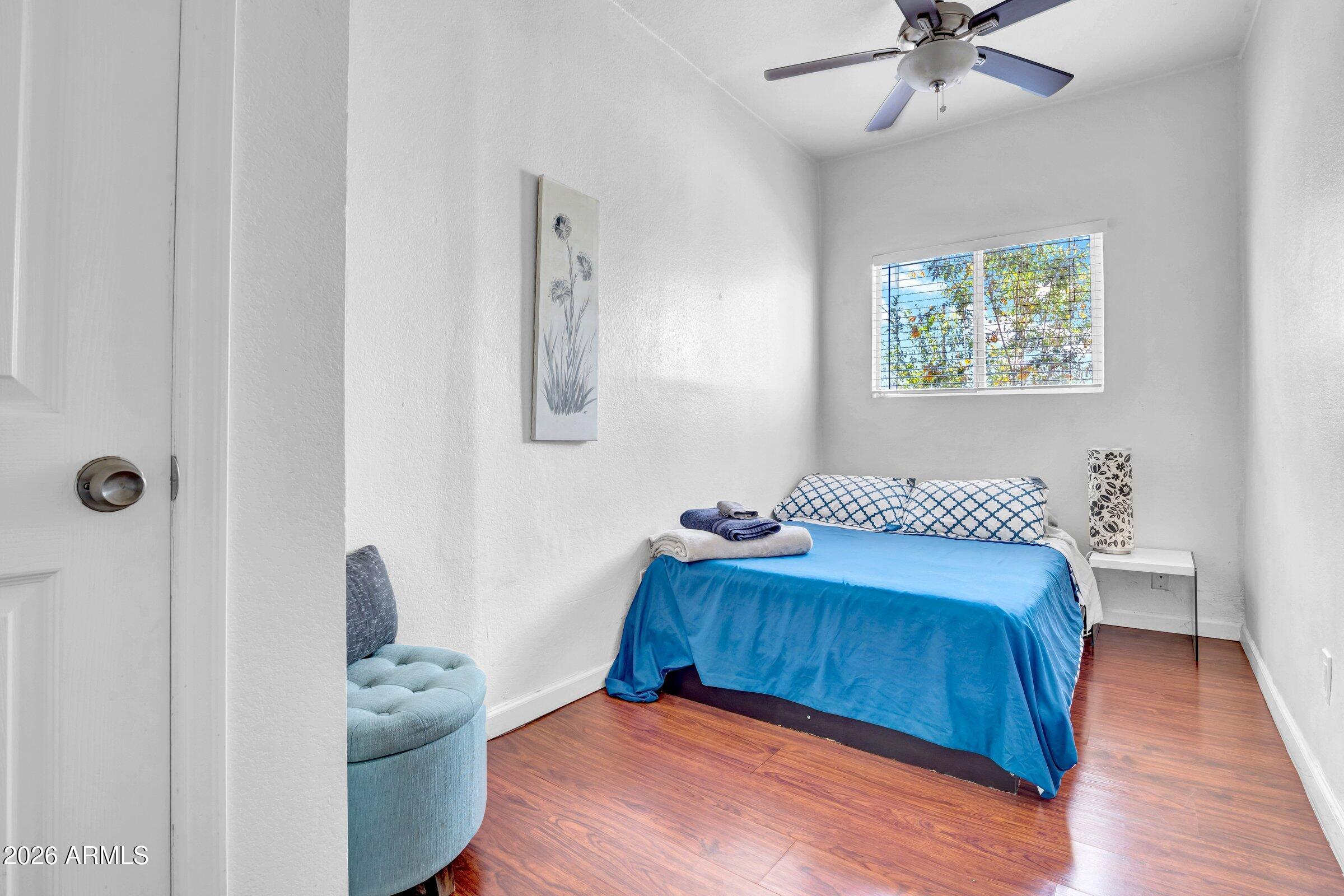 712 East Pierce Street Phoenix, AZ 85006 - Photo 11 of 39 a bedroom with a bed and a window