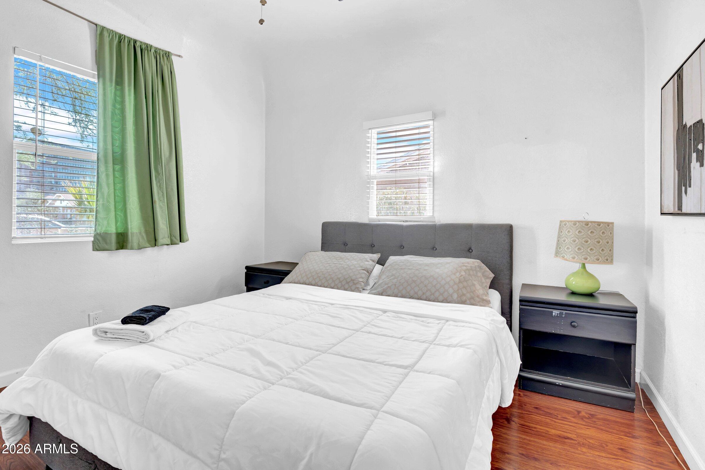 712 East Pierce Street Phoenix, AZ 85006 - Photo 13 of 39 a bedroom with a bed and a window