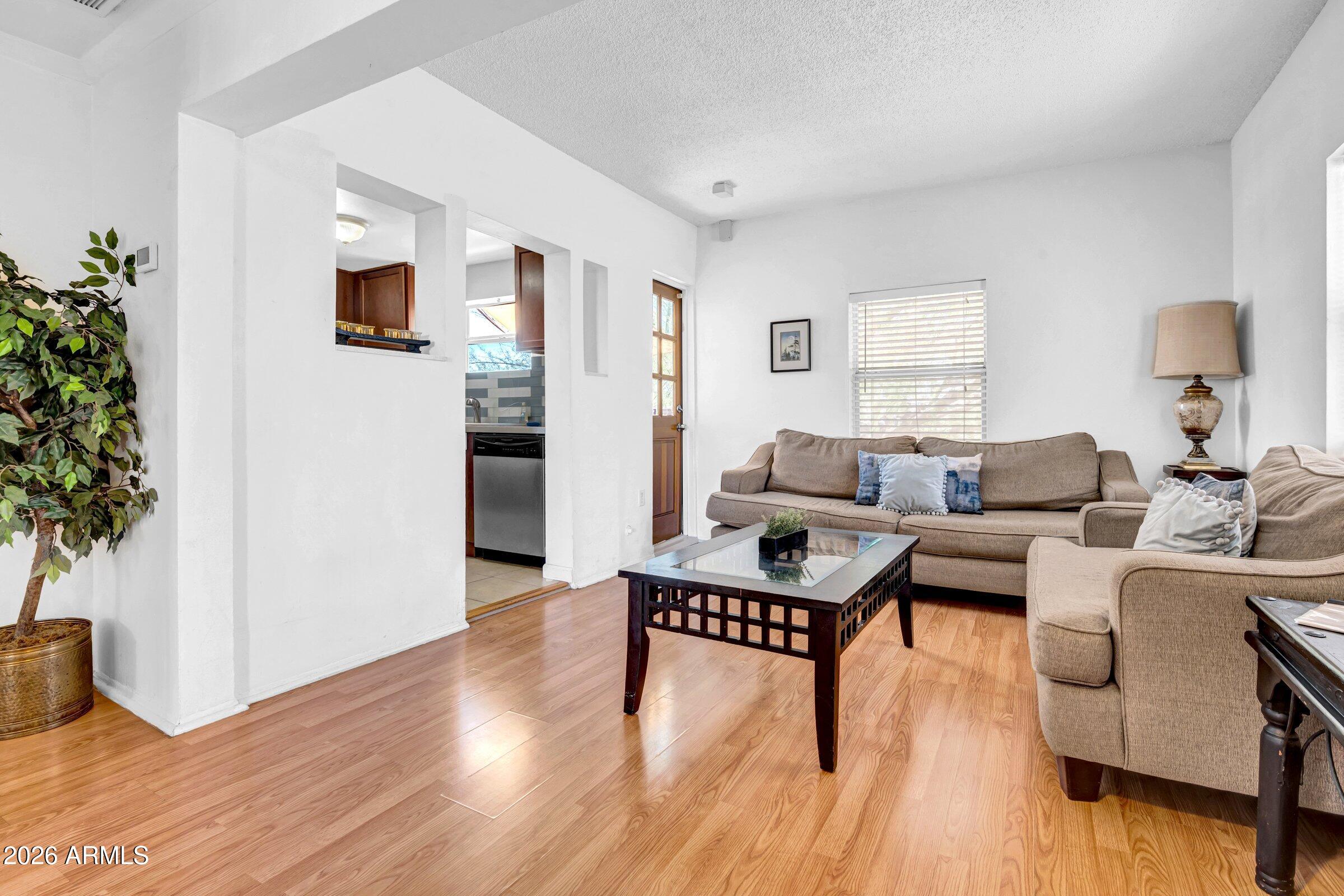 712 East Pierce Street Phoenix, AZ 85006 - Photo 14 of 39 a living room with furniture and a wooden floor
