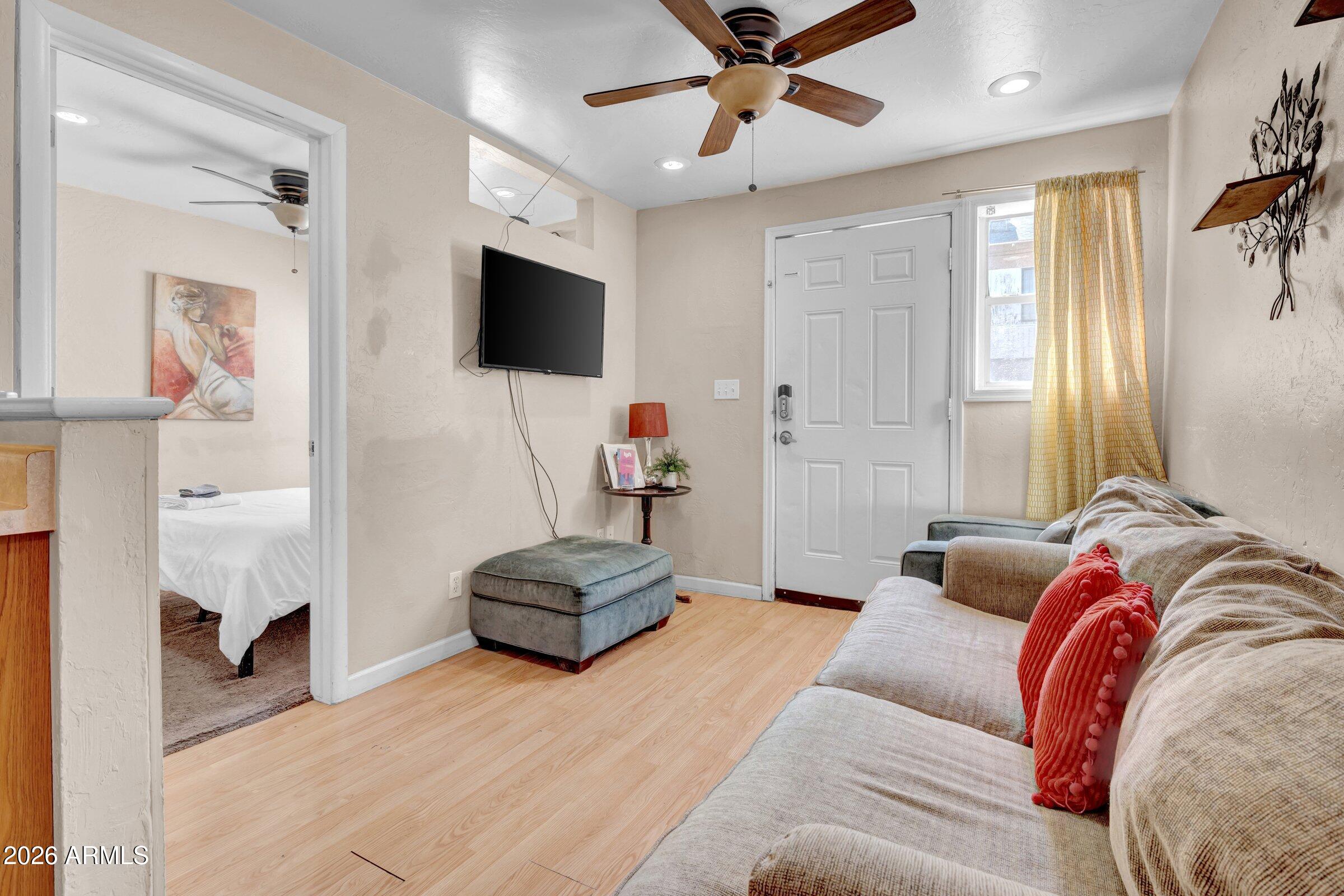 712 East Pierce Street Phoenix, AZ 85006 - Photo 21 of 39 a living room with furniture and a flat screen tv