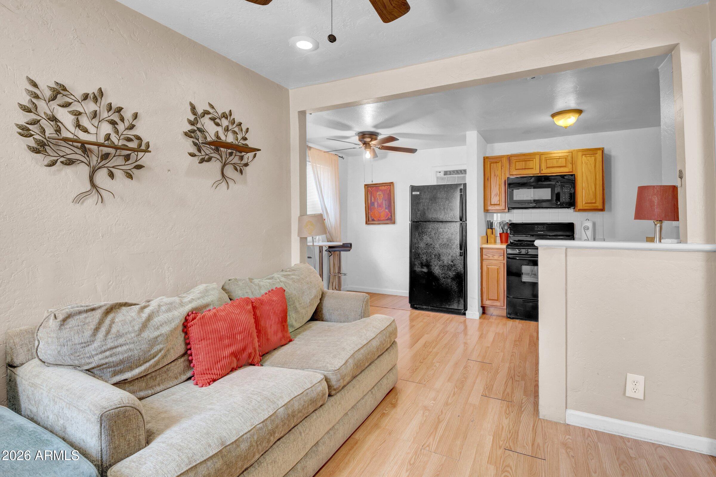 712 East Pierce Street Phoenix, AZ 85006 - Photo 22 of 39 a living room with furniture and a flat screen tv