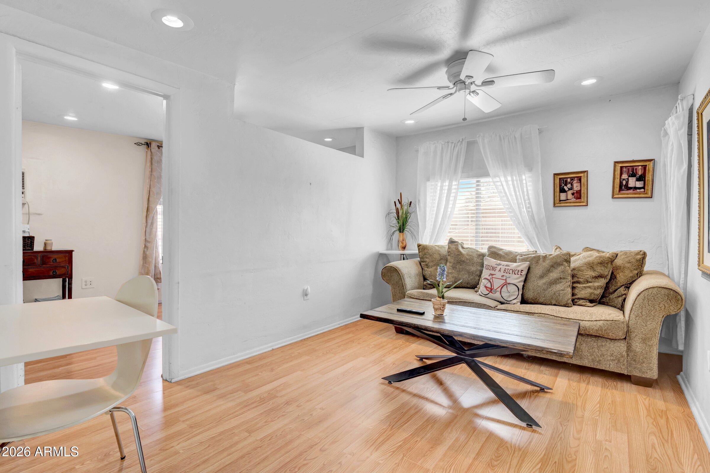 712 East Pierce Street Phoenix, AZ 85006 - Photo 29 of 39 a living room with furniture and a wooden floor